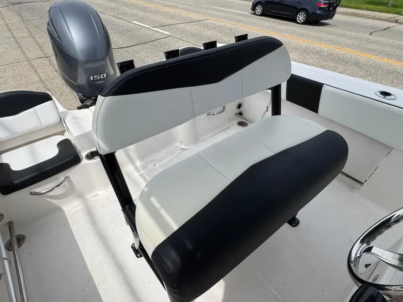Slide: The Image of 2018 Robalo R200 Center Console boat with black and white seating and Yamaha 150 engine. - 6