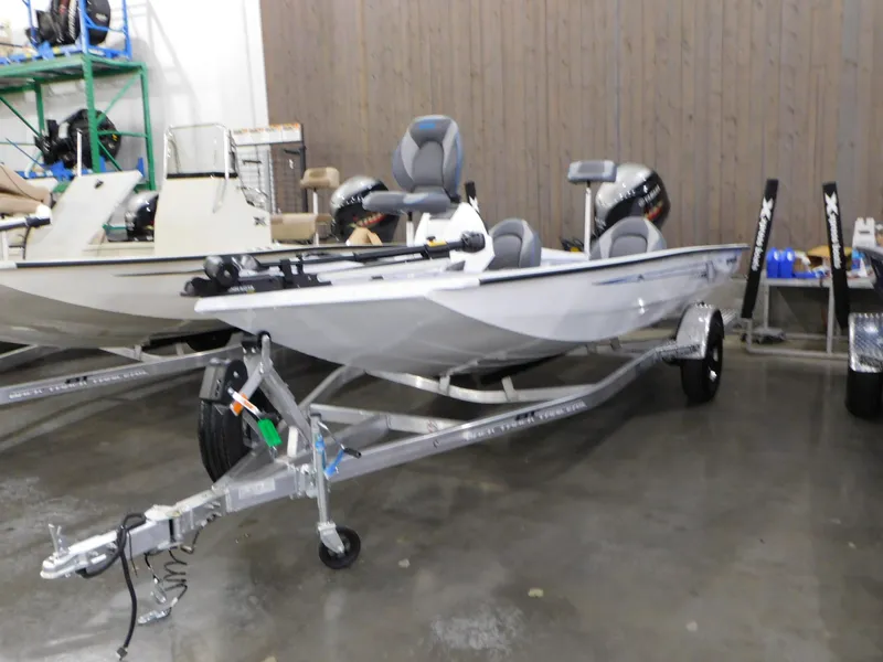 Slide: The Image of 2023 Xpress H18C fishing boat on trailer in showroom. - 1