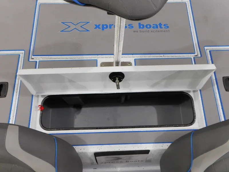 Slide: The Image of 2023 Xpress H18C boat interior with open storage compartment. - 12