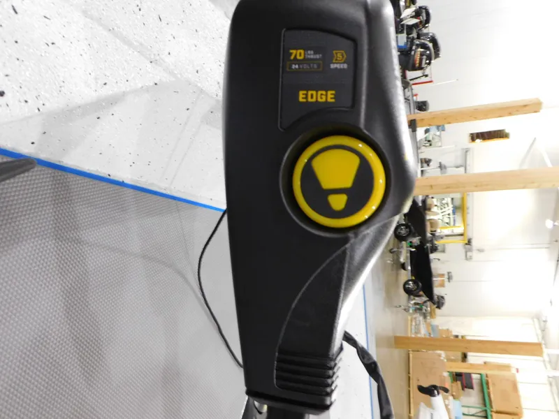 Slide: The Image of Close-up of Xpress H18C 2023 boat control panel with yellow button. - 15