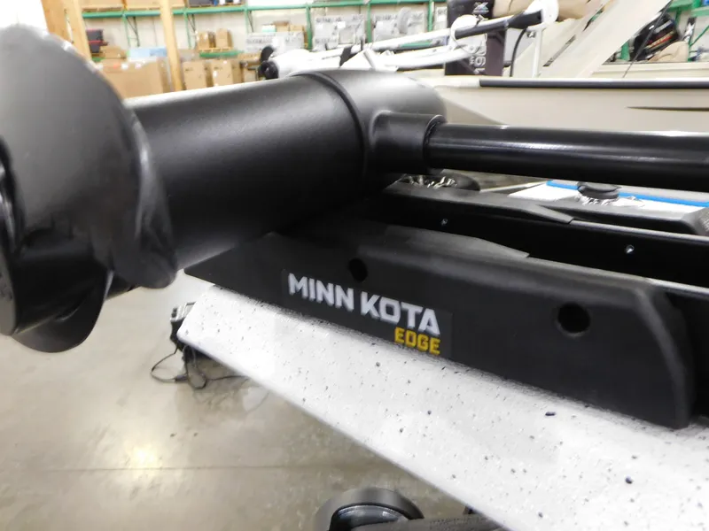 Slide: The Image of Minn Kota Edge trolling motor on 2023 Xpress H18C boat in a warehouse. - 17