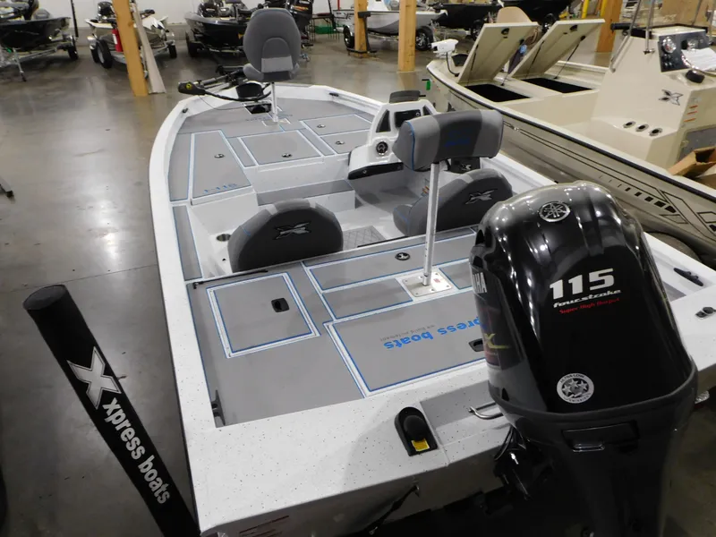 Slide: The Image of 2023 Xpress H18C fishing boat with Yamaha 115 outboard motor in showroom. - 3