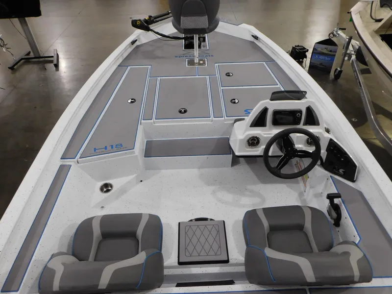 Slide: The Image of 2023 Xpress H18C fishing boat interior with dual seats and steering console. - 4