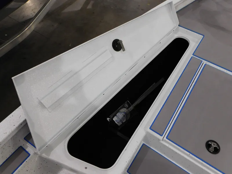 Slide: The Image of 2023 Xpress H18C boat storage compartment with open lid. - 7