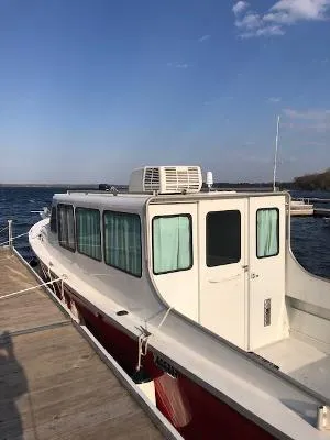 Slide: The Image of Custom 2008 Gasparek Marine Eco Trawler docked by the water on a sunny day. - 10