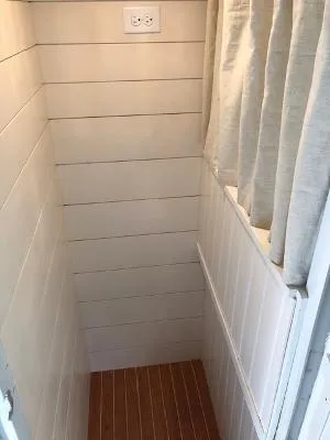 Slide: The Image of Small interior space with white shiplap walls and wooden floor on a 2008 Gasparek Marine Eco Trawler. - 17