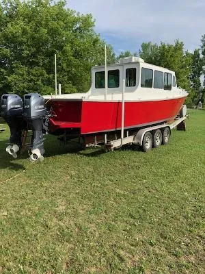 Slide: The Image of Custom 2008 Gasparek Marine Eco Trawler on trailer, red hull, dual outboard motors. - 20