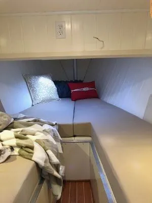 Slide: The Image of Cozy cabin interior of 2008 Gasparek Marine Eco Trawler with cushions and blankets. - 5