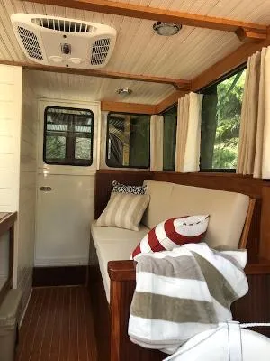 Slide: The Image of Interior of 2008 Gasparek Marine Eco Trawler with cozy seating and nautical decor. - 6