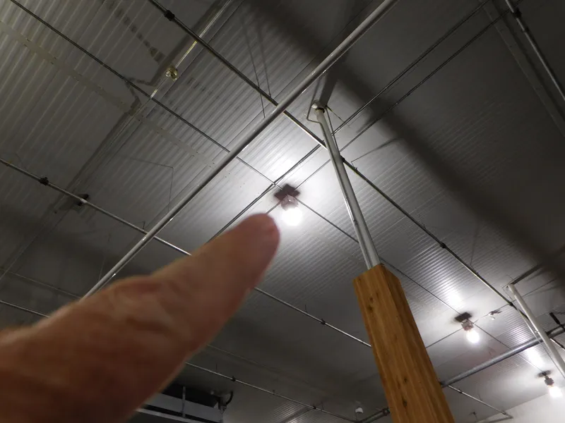 Slide: The Image of Person pointing at ceiling light in industrial building, Xpress H190B, 2023. - 15