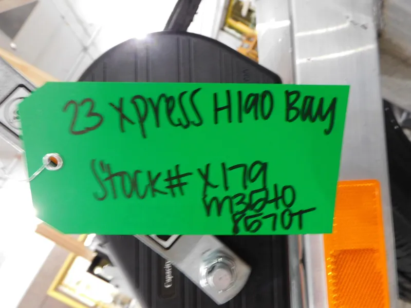 Slide: The Image of Green tag on 2023 Xpress H190B boat with stock number X179. - 16