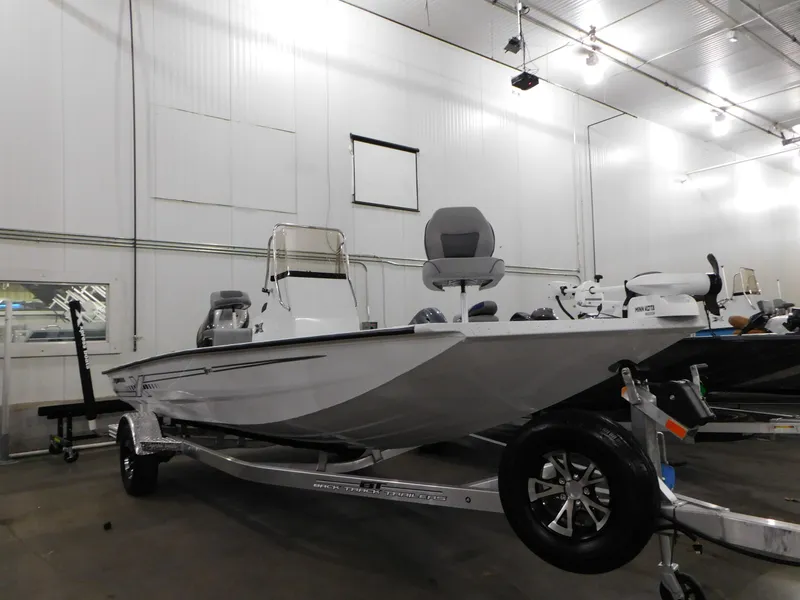 Slide: The Image of 2023 Xpress H190B boat in showroom, side view. - 17
