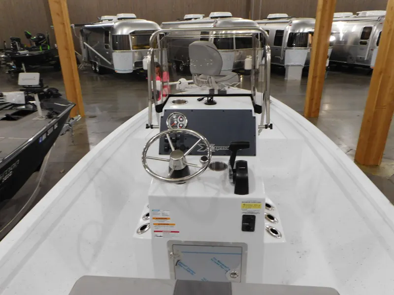 Slide: The Image of 2023 Xpress H190B boat interior with steering console and control panel. - 21