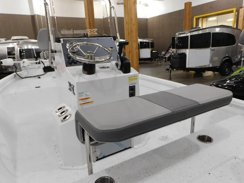 Slide: The Image of 2023 Xpress H190B boat interior with steering console and seating. - 26