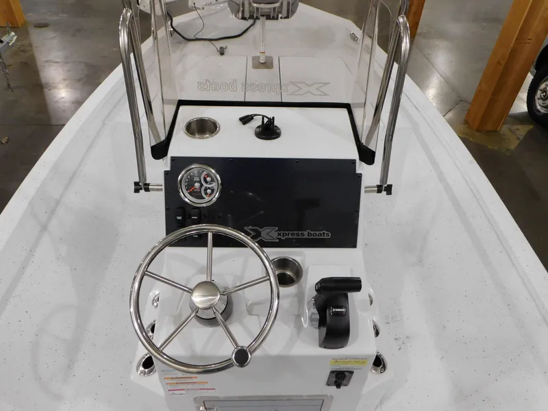 Slide: The Image of 2023 Xpress H190B boat console with steering wheel and controls. - 4