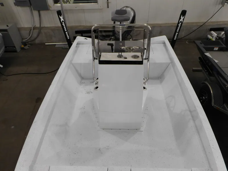 Slide: The Image of 2023 Xpress H190B boat interior with center console in a garage. - 7