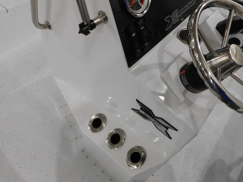 Slide: The Image of 2023 Xpress H190B boat console with steering wheel and control panel. - 9