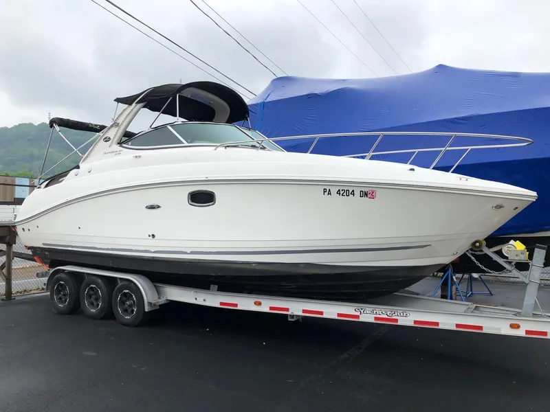 The Image of 2009 Sea Ray 270 Sundancer on a trailer, ready for transport. - 1