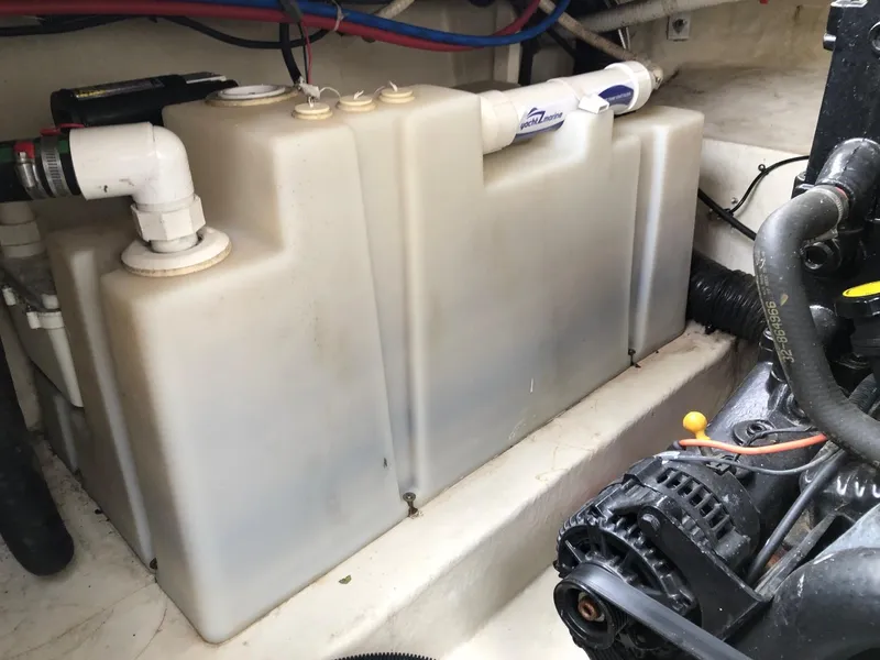 Slide: The Image of Engine compartment of a 2009 Sea Ray 270 Sundancer boat showing a water tank. - 14