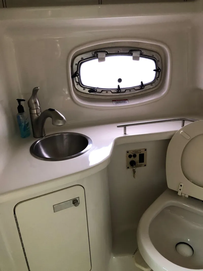 Slide: The Image of 2009 Sea Ray 270 Sundancer bathroom with sink and toilet - 27