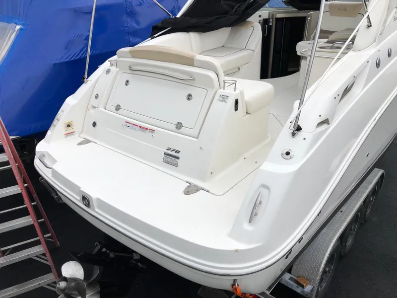Slide: The Image of 2009 Sea Ray 270 Sundancer boat stern view on trailer. - 5