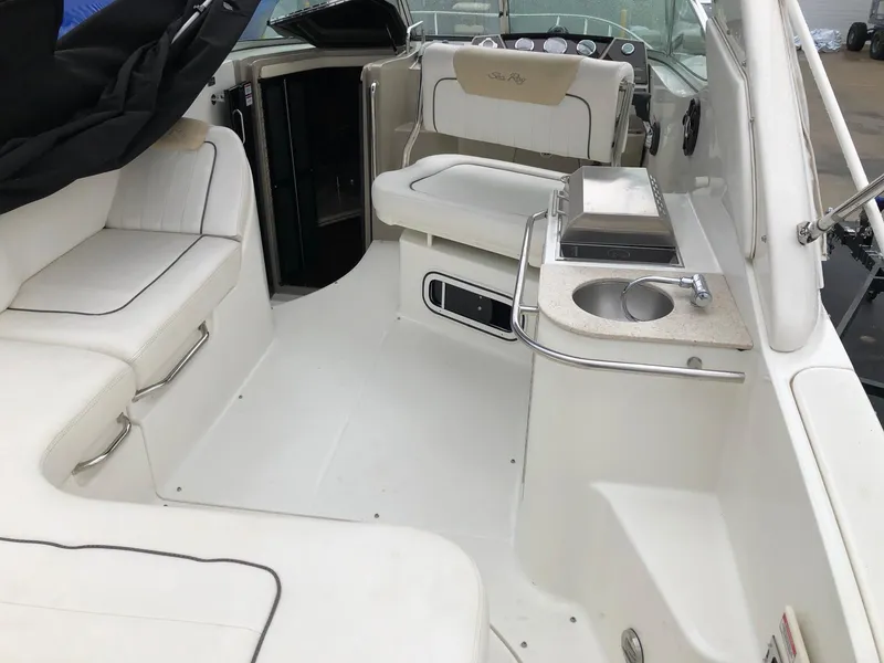 Slide: The Image of 2009 Sea Ray 270 Sundancer boat interior with seating and kitchenette. - 7