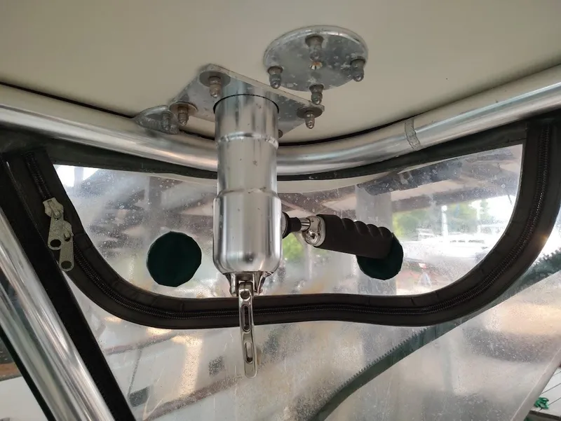 Slide: The Image of Ceiling-mounted rod holder on a 2002 Pursuit 3000 Express boat. - 29