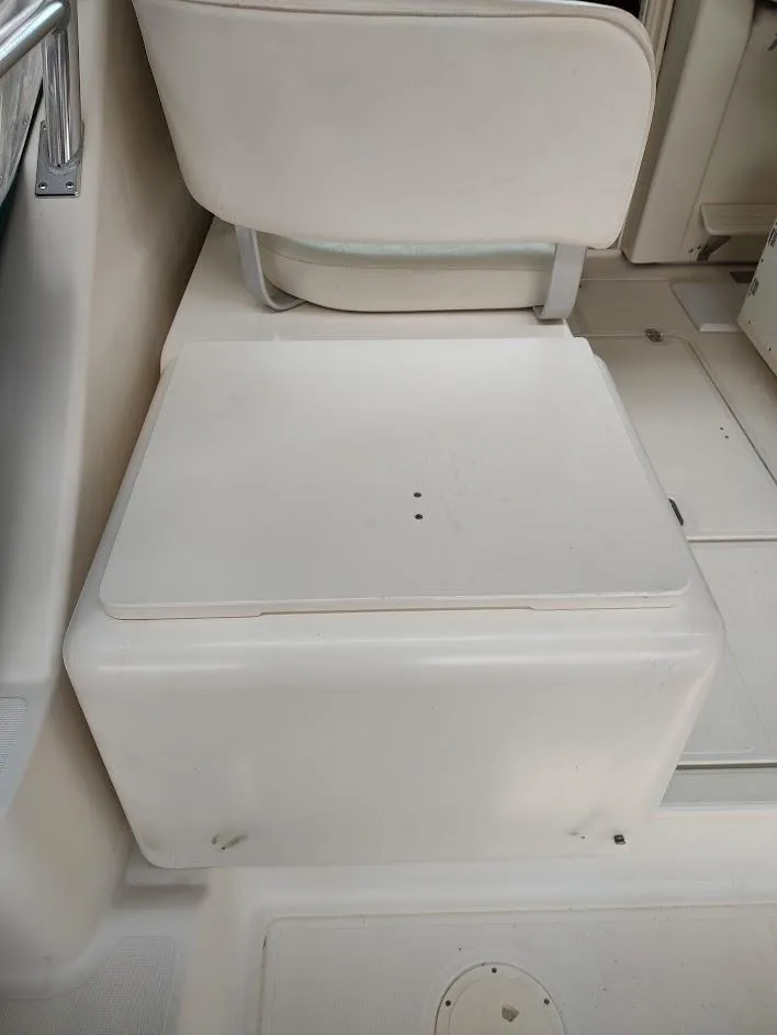 Slide: The Image of 2002 Pursuit 3000 Express boat interior seating area. - 37