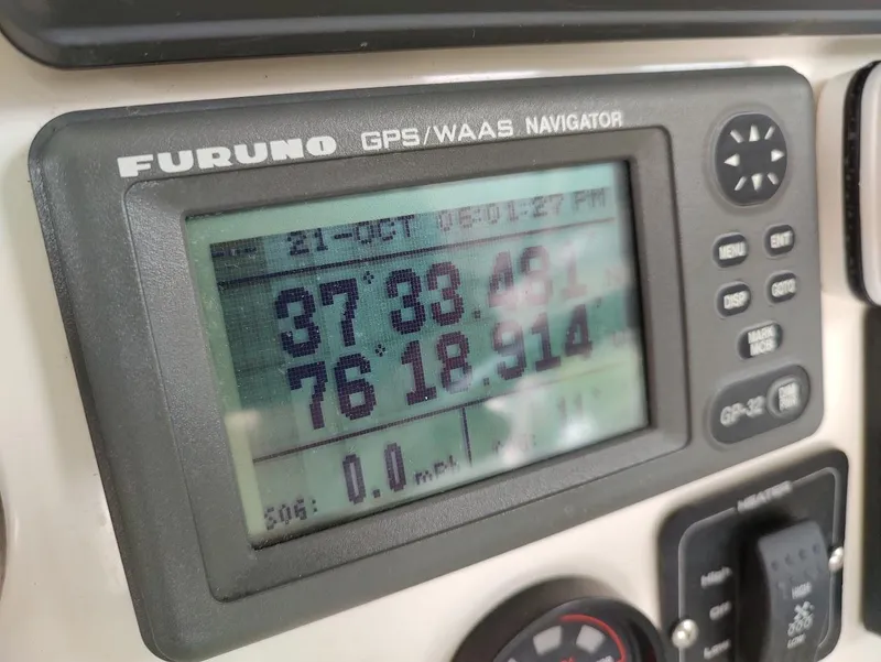 Slide: The Image of Furuno GPS display on 2002 Pursuit 3000 Express boat showing coordinates. - 47