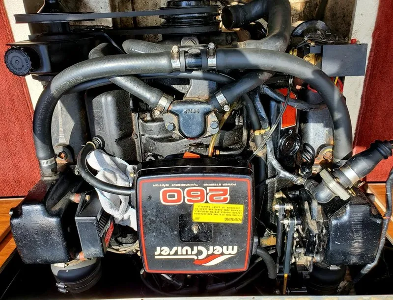 Slide: The Image of 1984 Sea Ray 225 Cuddy Cabin MerCruiser 260 engine in good condition. - 11