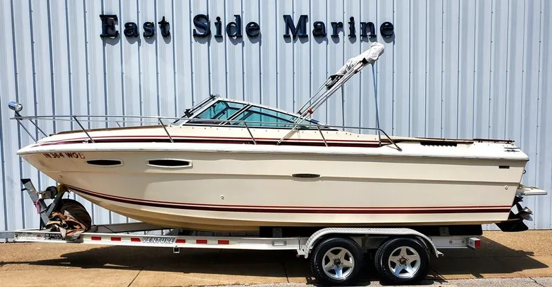 Slide: The Image of 1984 Sea Ray 225 Cuddy Cabin boat on trailer at East Side Marine. - 18