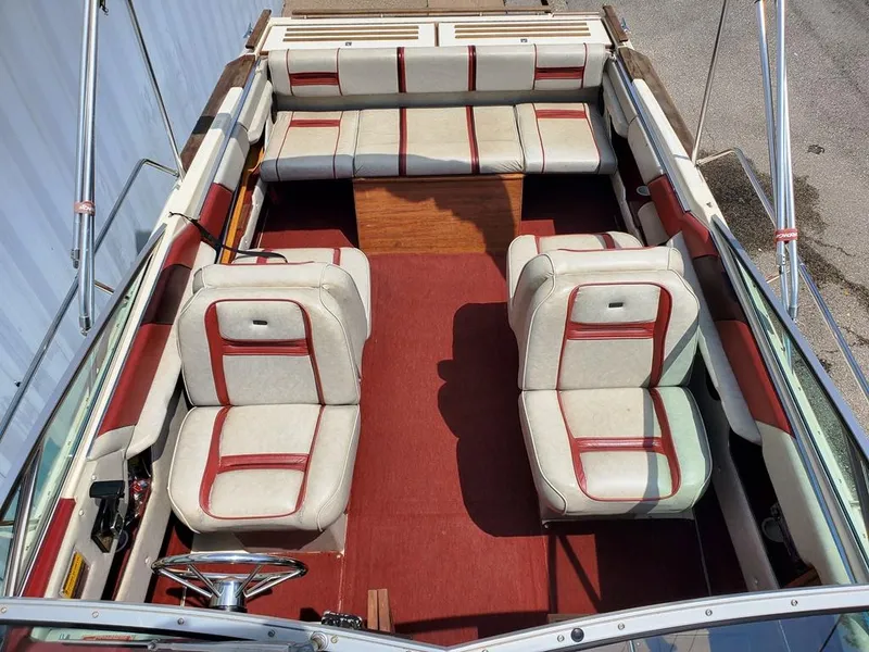 Slide: The Image of 1984 Sea Ray 225 Cuddy Cabin interior with red and white seating. - 3