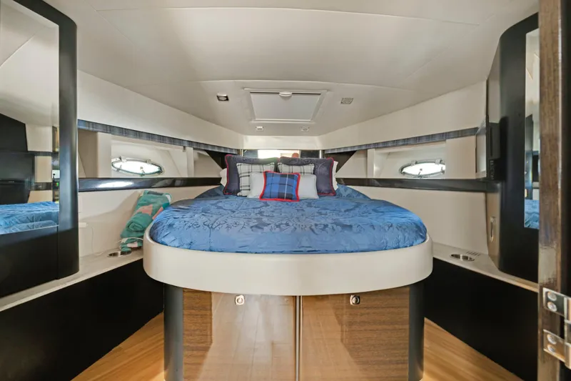 Slide: The Image of Luxurious bedroom interior of 2016 Formula 40 PC yacht with blue bedding. - 13