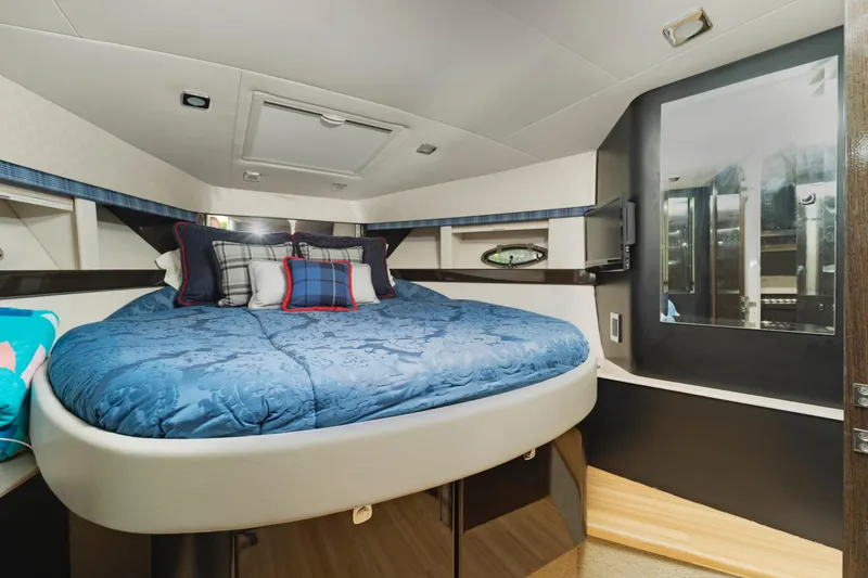 Slide: The Image of Luxurious bedroom interior of 2016 Formula 40 PC yacht with blue bedding and modern design. - 14