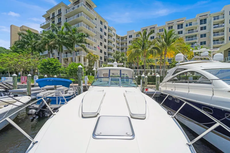 Slide: The Image of 2016 Formula 40 PC yacht docked at marina with luxury condos in background. - 4