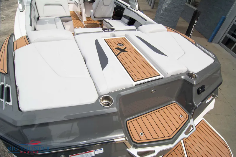 Slide: The Image of 2021 MasterCraft XStar boat with teak deck and white seating. - 11