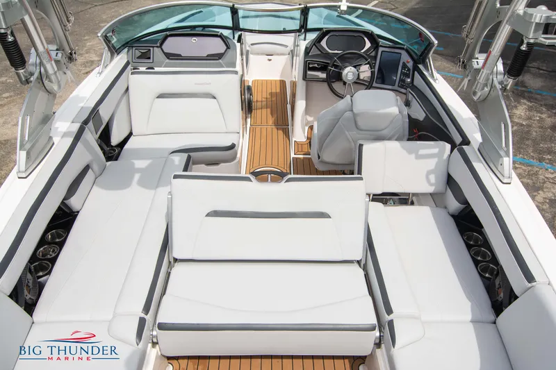 Slide: The Image of 2021 MasterCraft XStar boat interior with white seating and teak flooring. - 15