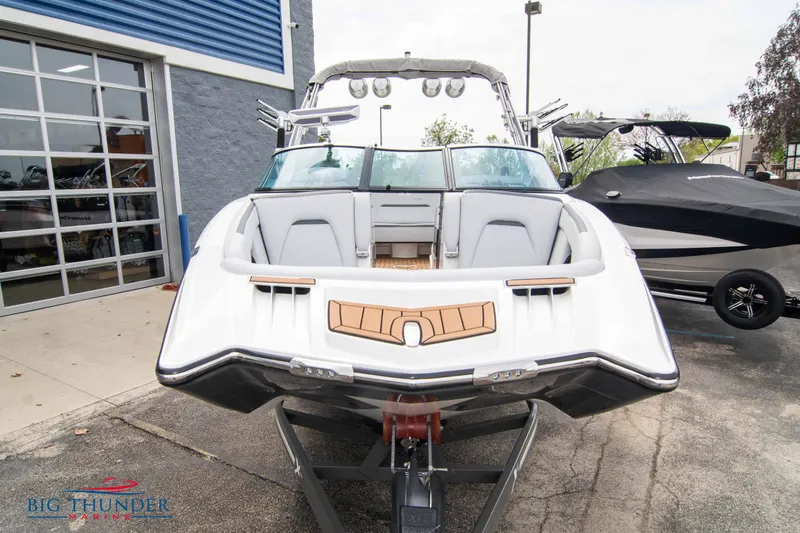 Slide: The Image of 2021 MasterCraft XStar boat on trailer, front view at dealership. - 2