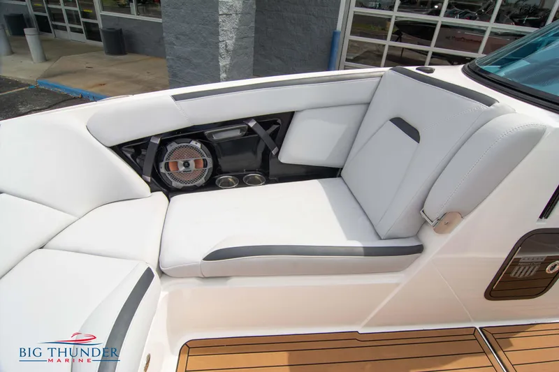 Slide: The Image of 2021 MasterCraft XStar boat interior with white seating and speaker system. - 39