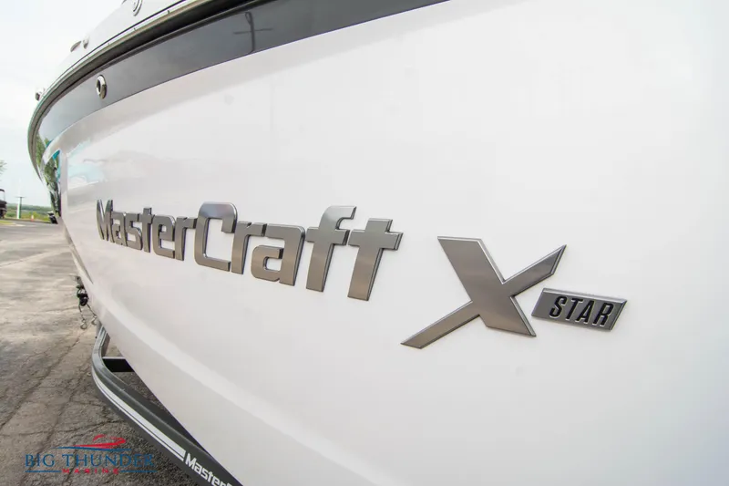 Slide: The Image of 2021 MasterCraft XStar boat side view with logo. - 4