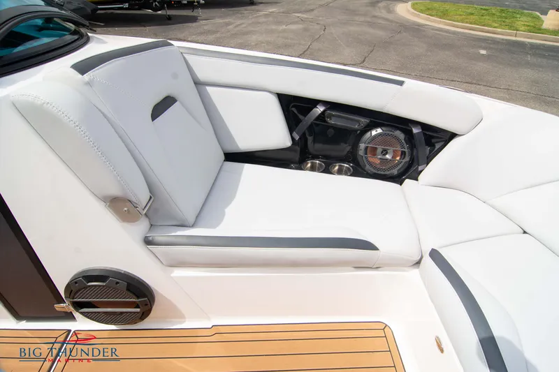 Slide: The Image of 2021 MasterCraft XStar boat interior with white seating and audio system. - 40