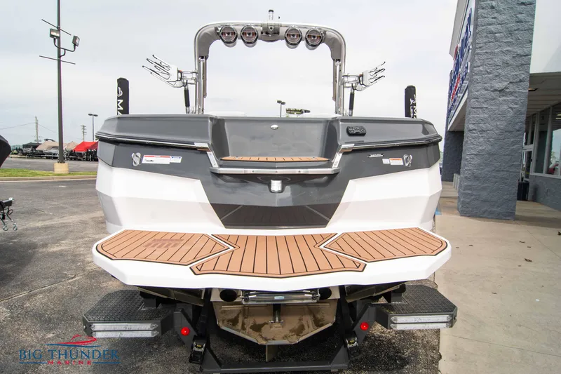 Slide: The Image of 2021 MasterCraft XStar boat rear view with teak swim platform. - 6