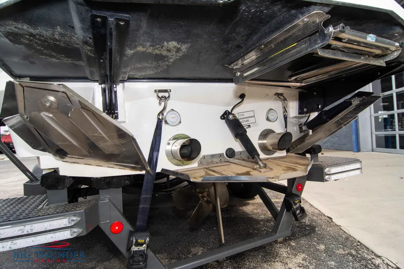 Slide: The Image of 2021 MasterCraft XStar boat stern with propeller and trim tabs. - 7