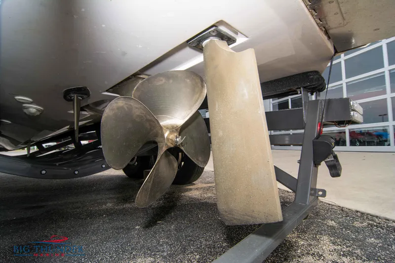 Slide: The Image of 2021 MasterCraft XStar boat propeller and rudder close-up. - 8