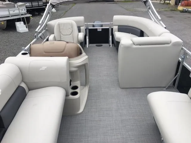 Slide: The Image of 2023 Starcraft LX 18 R pontoon boat interior with spacious seating and modern design. - 1