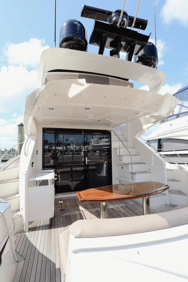 Slide: The Image of 2017 Marquis 500 Sport Yacht with spacious deck and modern amenities. - 10