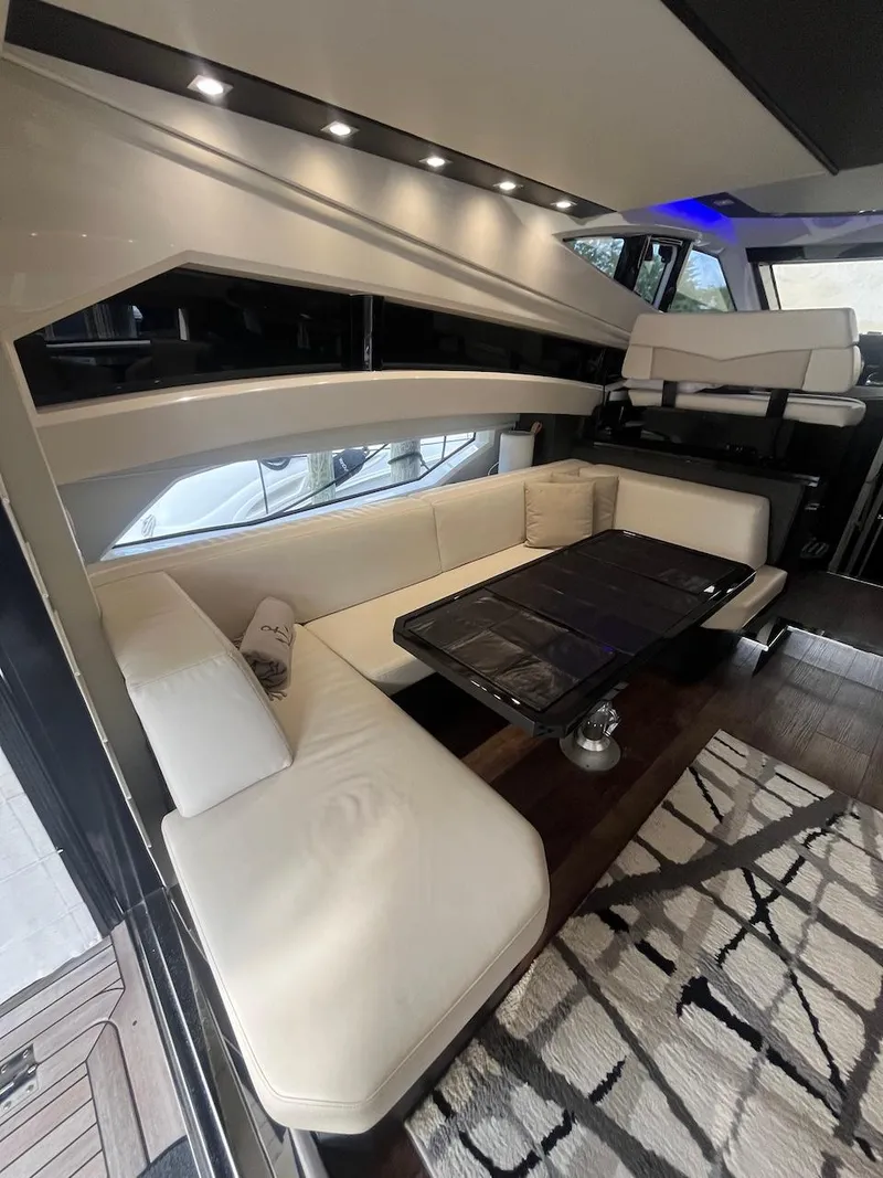Slide: The Image of Interior of 2017 Marquis 500 Sport Yacht with white leather seating and modern decor. - 31