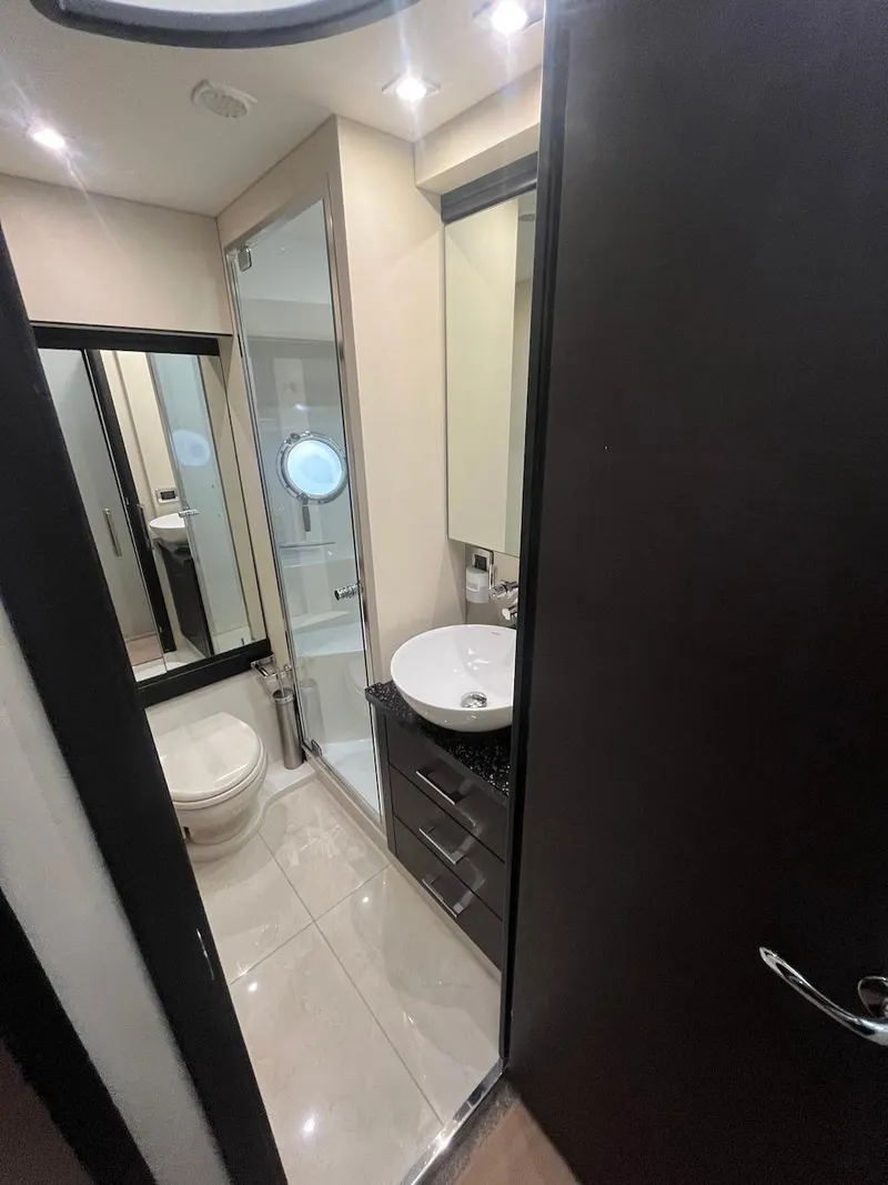 Slide: The Image of Modern bathroom in 2017 Marquis 500 Sport Yacht with sleek fixtures and ample lighting. - 40