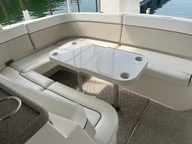 Slide: The Image of 2007 Rinker 420 Express Cruiser interior seating area with table. - 5