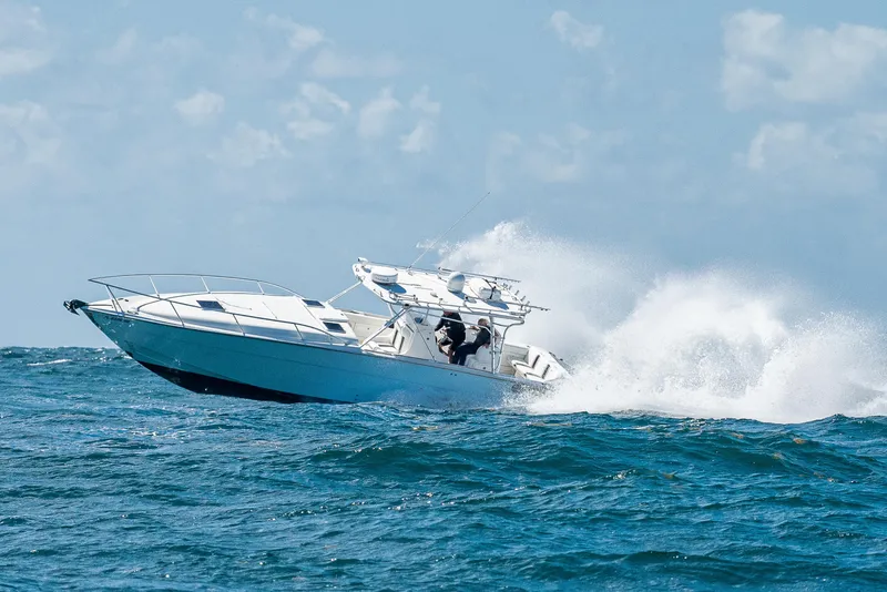 Slide: The Image of 2007 Marlin Yachts 42 model cruising through ocean waves. - 7